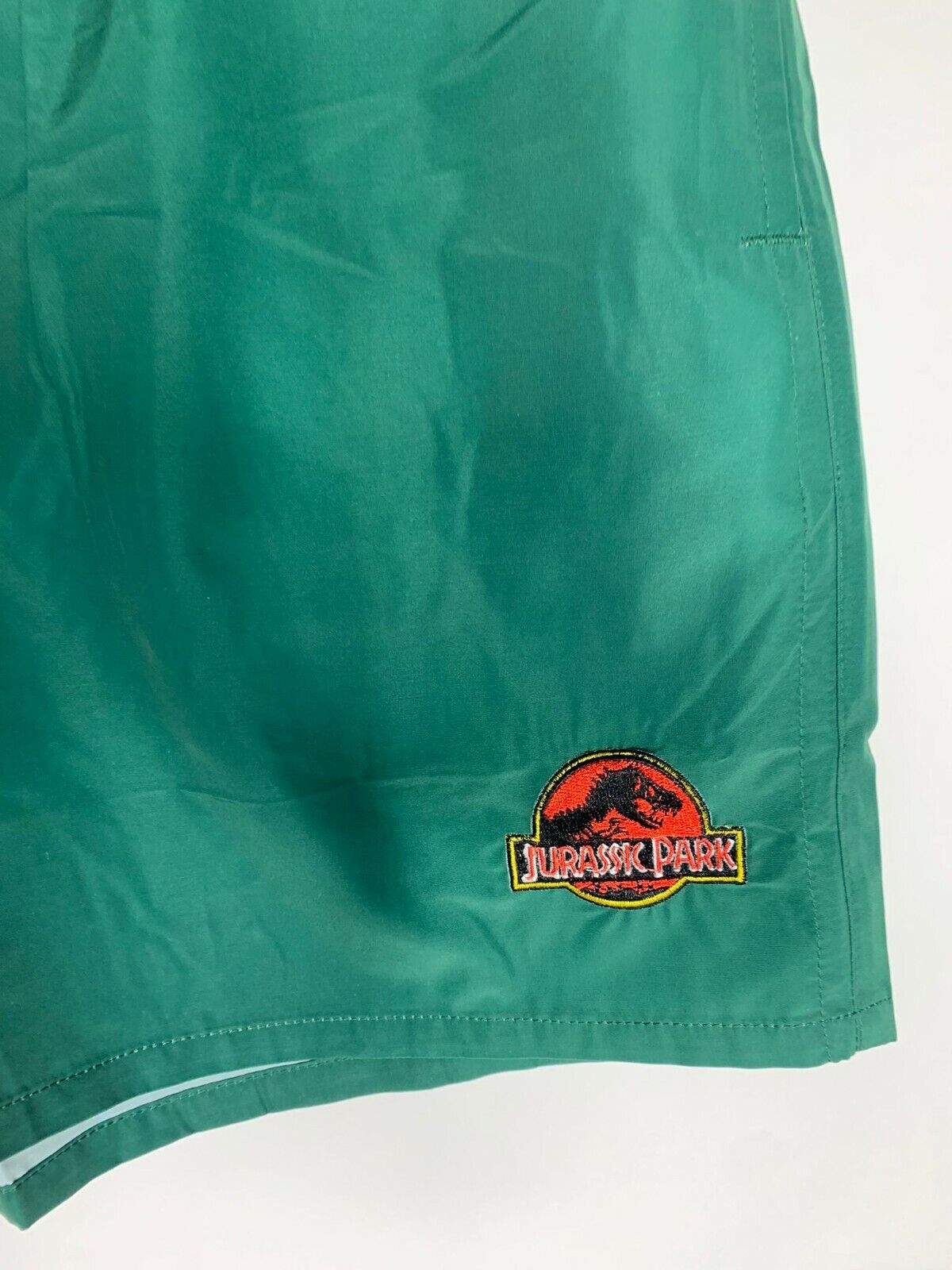 Dumbgood Mens XL Green Lined Jurassic Park Swim Trunks Swimsuit Logo Teal Shorts